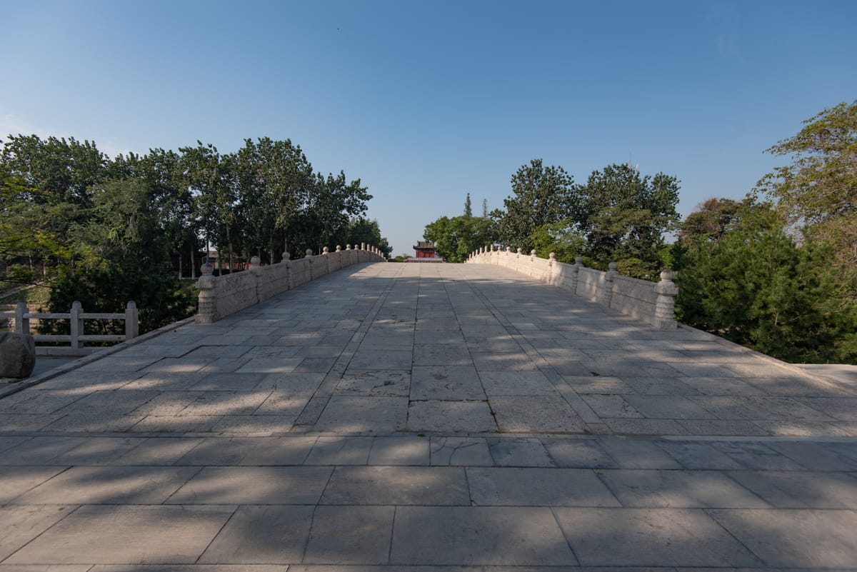Looking along the broad stone deck of the bridge, still open to pedestrians after fourteen centuries.