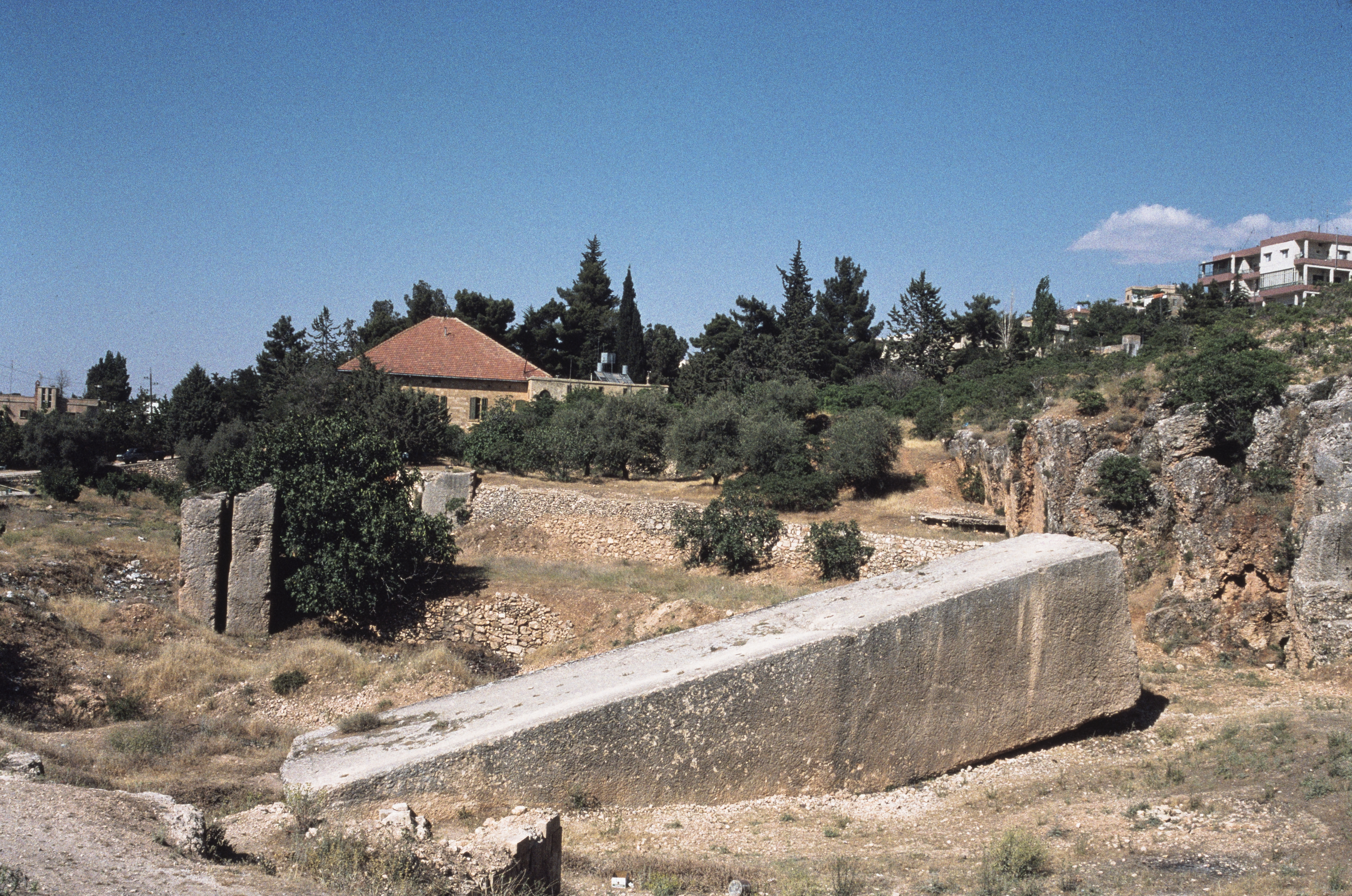 Partially quarried megaliths still embedded in the bedrock at the Baalbek quarry, illustrating how the blocks were cut directly from the stone shelf.