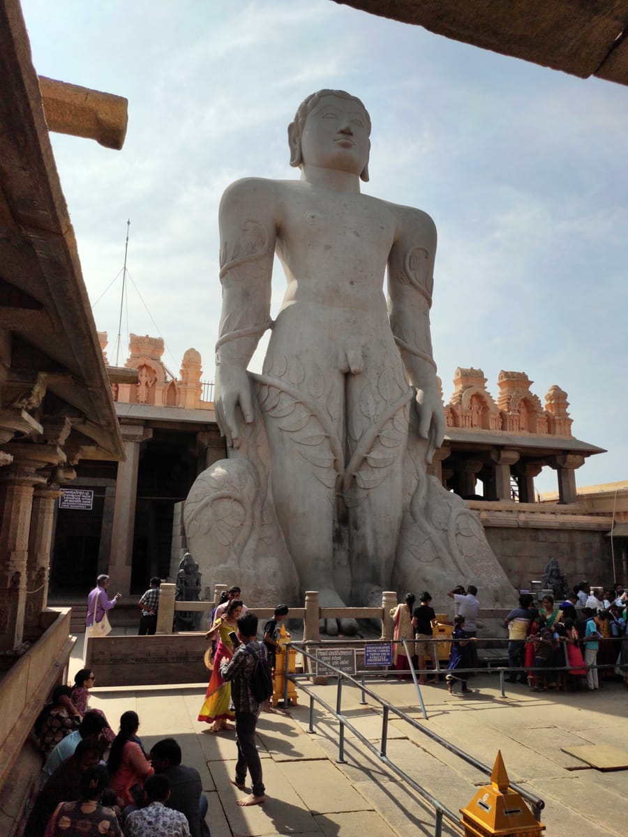 The statue of Bahubali viewed from the temple courtyard atop Vindhyagiri Hill.