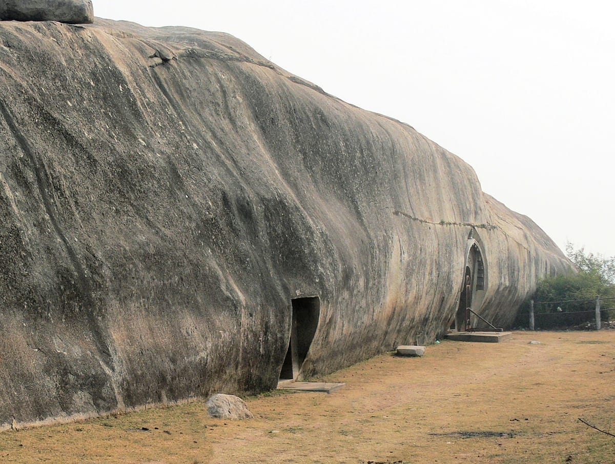 The adjacent entrances of the Sudama and Lomas Rishi caves on Barabar Hill, cut side by side into the same granite outcrop.