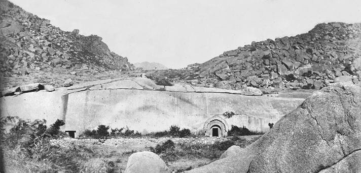 An 1870 photograph of Barabar Hill showing the Sudama and Lomas Rishi cave entrances, among the earliest photographic records of the site.