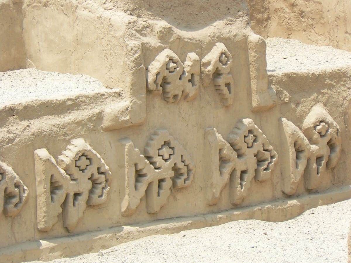 Low-relief adobe friezes at Chan Chan depicting sea life and seabirds, reflecting the maritime economy of the Chimú coast.