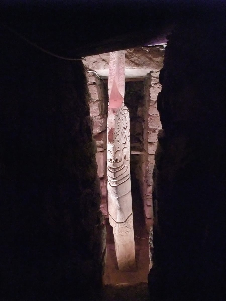 The Lanzón, the carved granite monolith still standing in situ at the center of the Old Temple's gallery system.