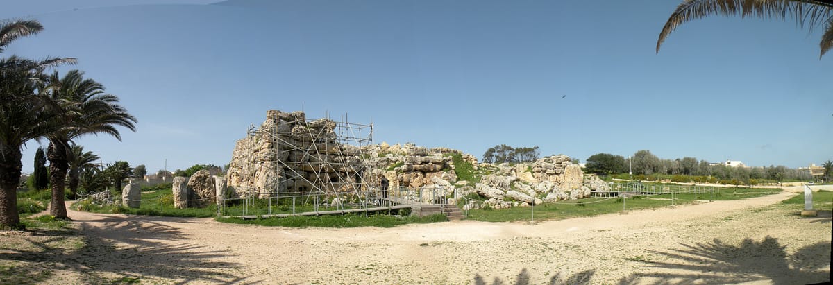 Panoramic view of the Ġgantija temple complex, showing the two adjacent temples within their shared boundary wall.