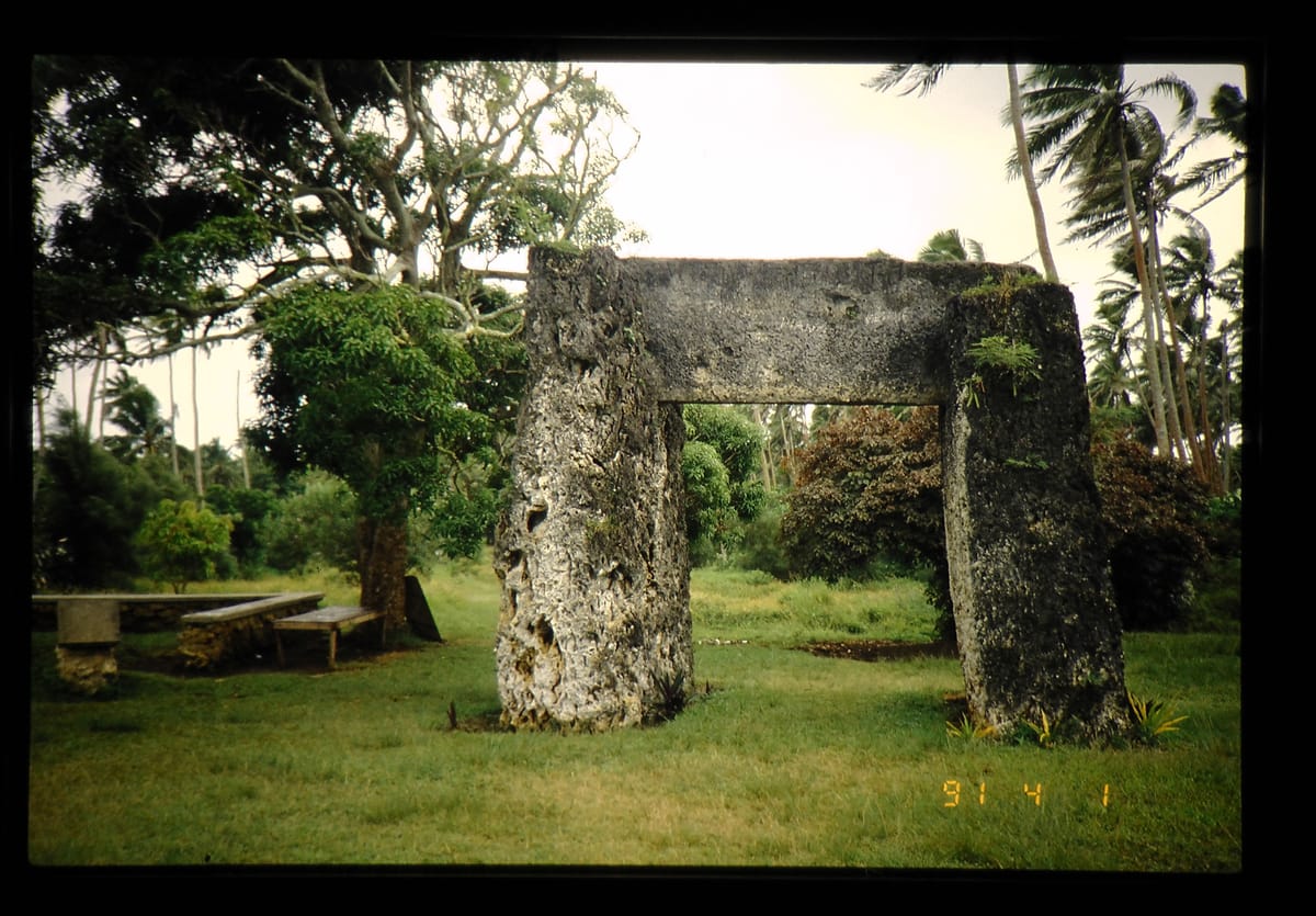The monument photographed in 1991. The deeply pitted, cavernous texture is characteristic of the raised coral limestone the slabs were cut from.