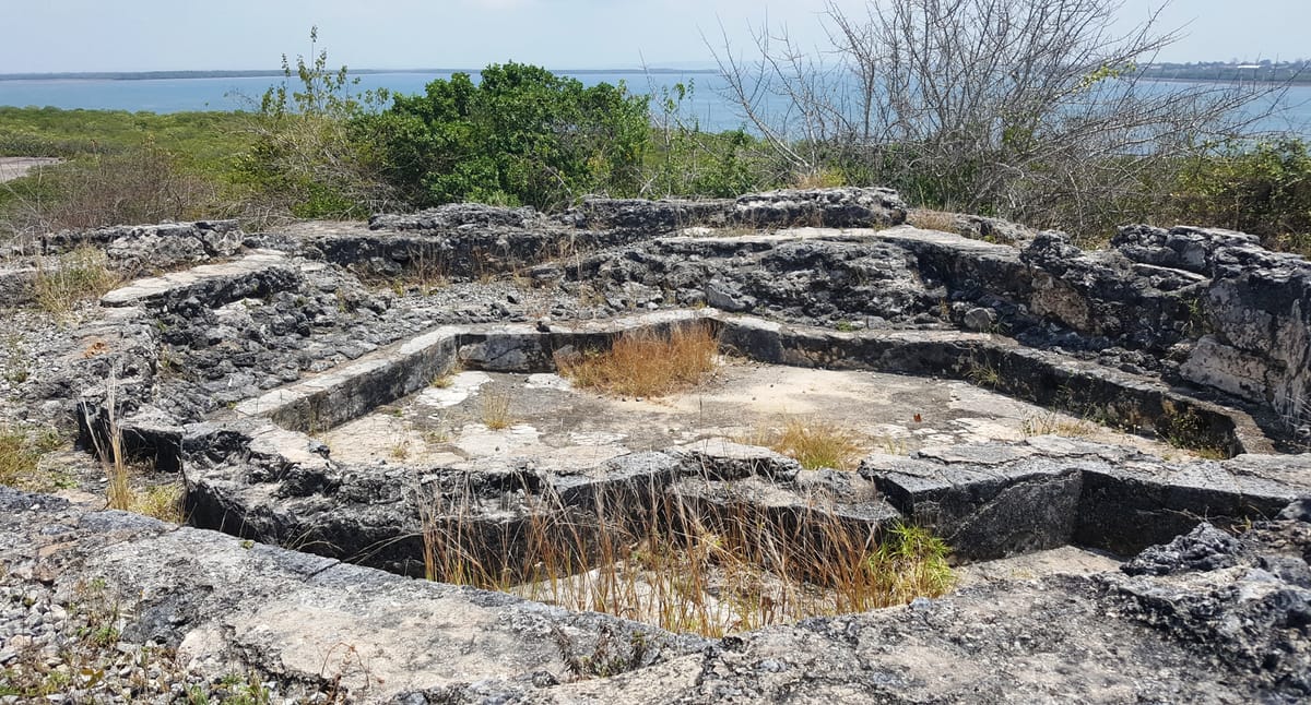 The octagonal bathing pool, sunk into the coral bedrock of the palace's domestic court — the feature that most clearly ties Husuni Kubwa to the wider Islamic palace tradition.