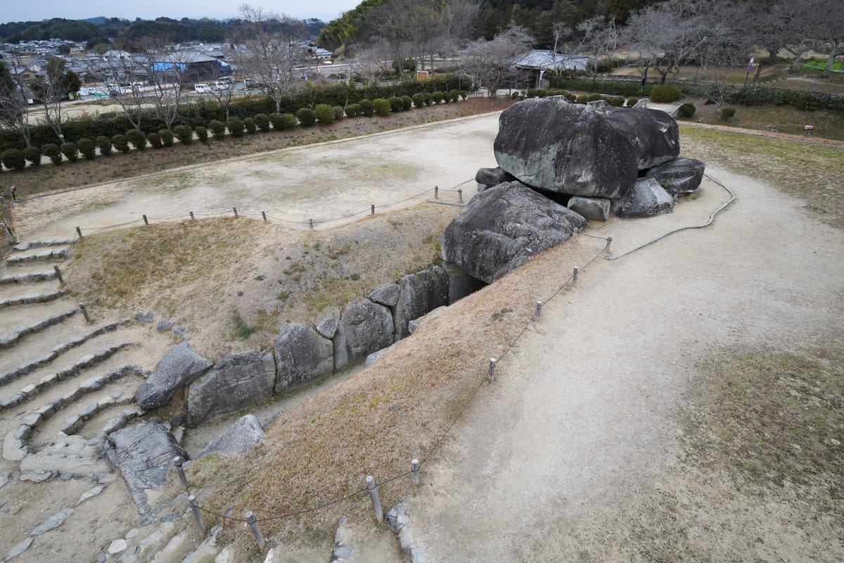 Seen from above: the sunken passage cut into the platform, leading to the chamber and its capstones.