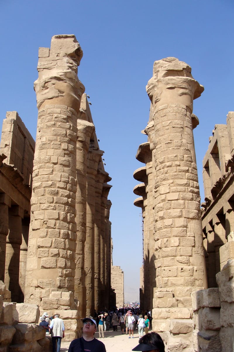 Looking up through the densely packed columns. The hall's 134 columns in 16 rows once supported a continuous stone roof, leaving the interior in deep shade.