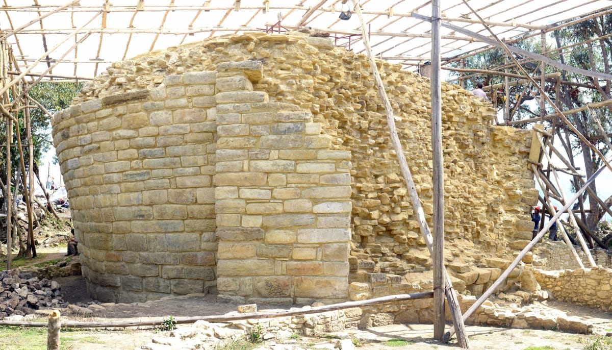 El Tintero, the inverted-cone structure at the southern end of the site, seen under restoration scaffolding — its purpose is still debated.