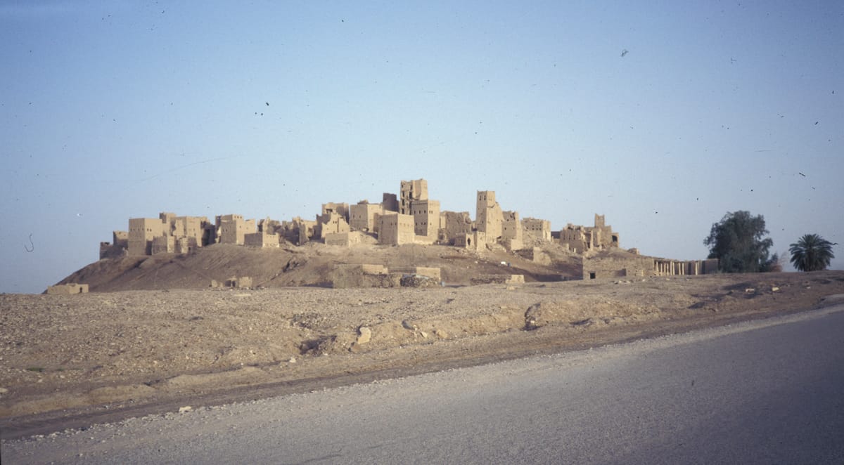 The abandoned mudbrick city of Old Marib, built on its ancient tell and once sustained by the dam's irrigation network, photographed in 1988.