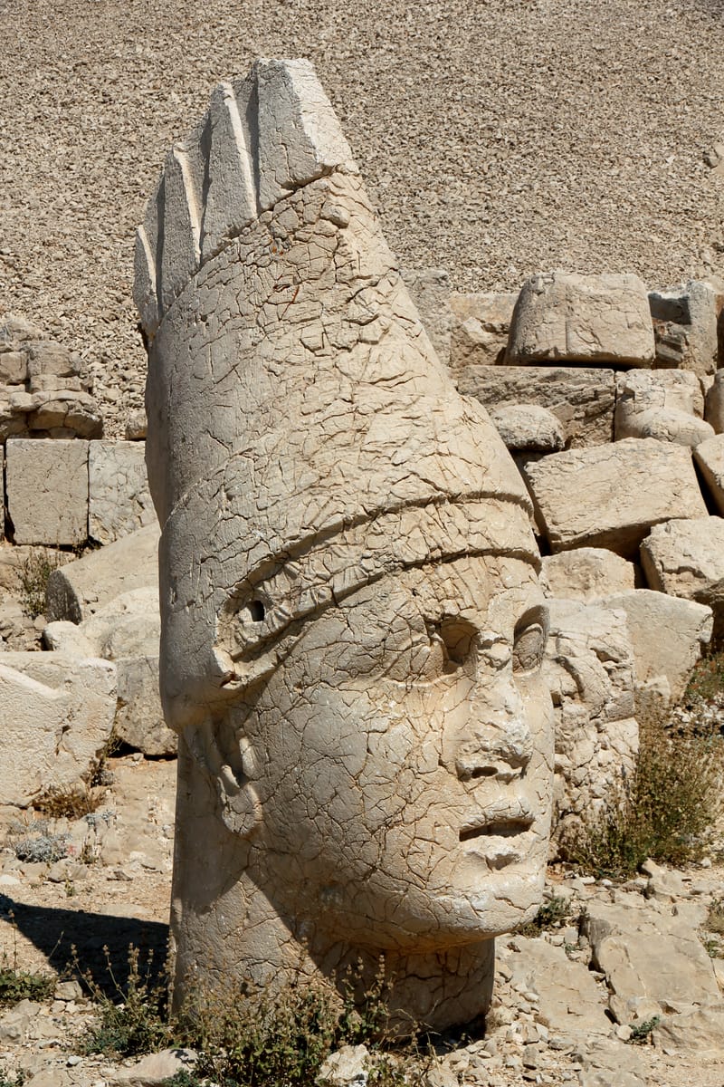 The head of Antiochus I from the West Terrace, wearing the pointed Armenian tiara that marks his Persian royal descent.
