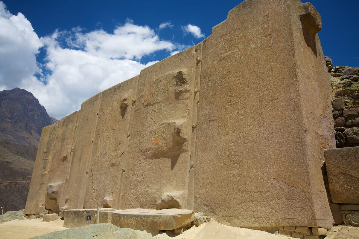 The Wall of the Six Monoliths in the Temple of the Sun, showing the colossal rose-rhyolite blocks and their narrow vertical spacer stones.