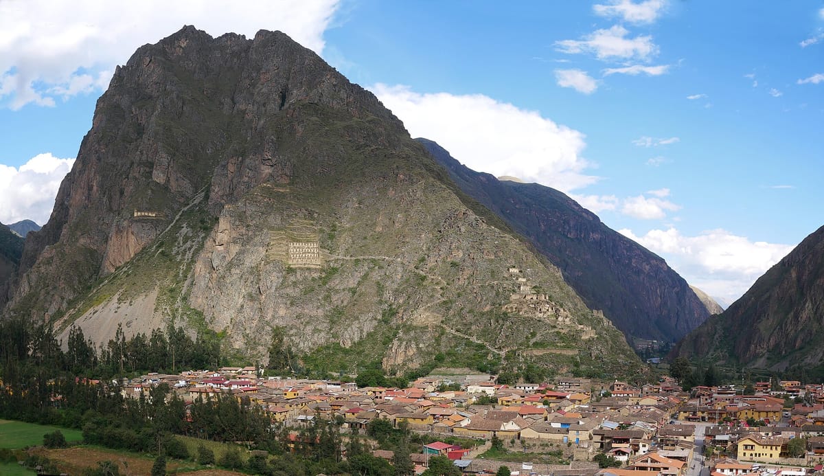 The living town of Ollantaytambo and its surrounding terraces, seen beneath the storehouses and ceremonial structures on the mountainside.