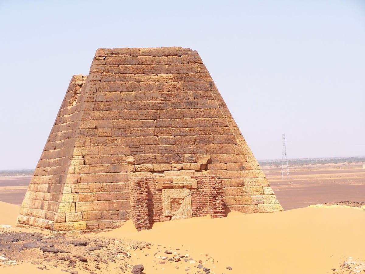 Pyramid N14 at Meroë, showing the characteristically steep, stepped profile of Kushite royal tombs.