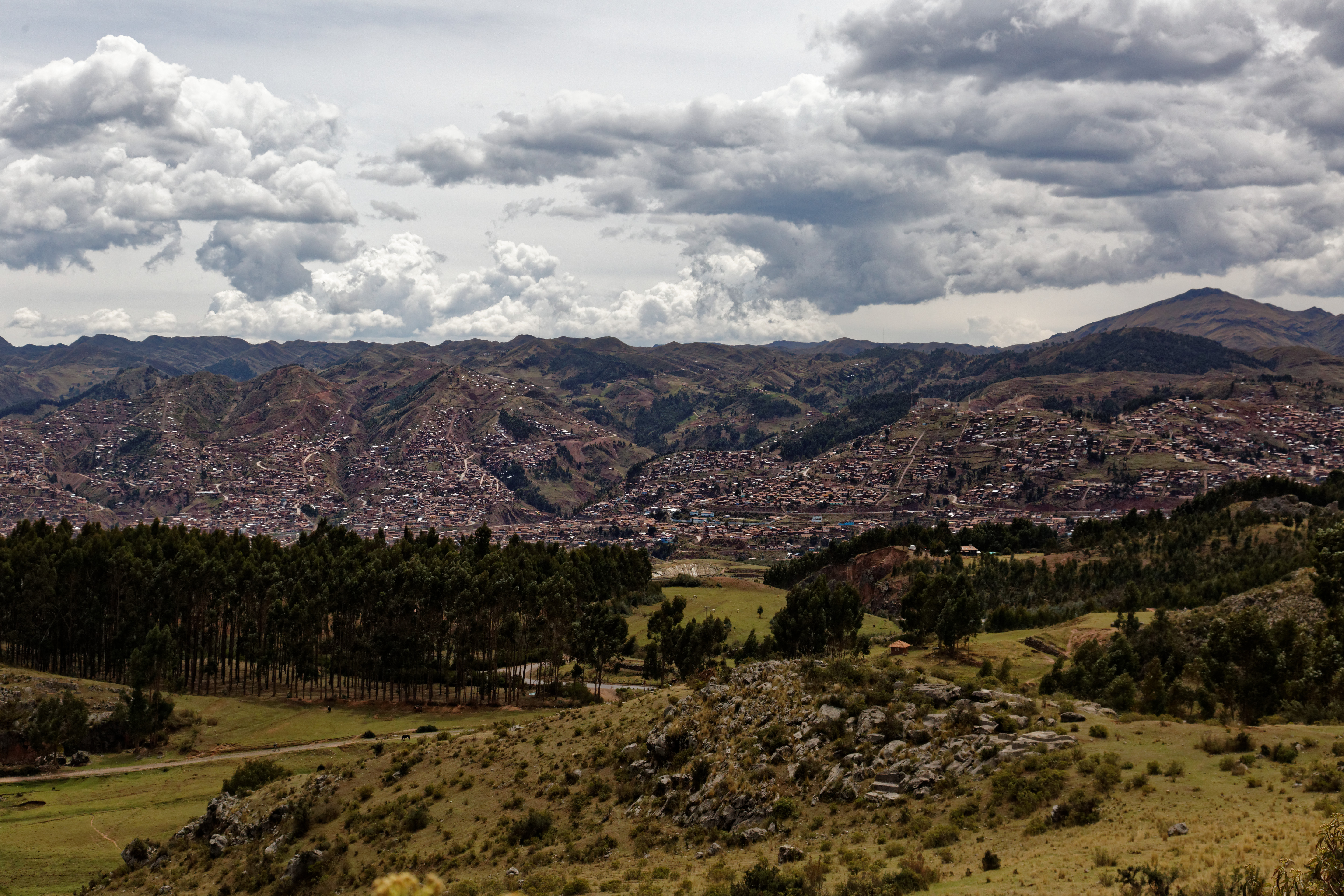 Aerial view of Sacsayhuamán's terraced complex on the hill overlooking Cusco.