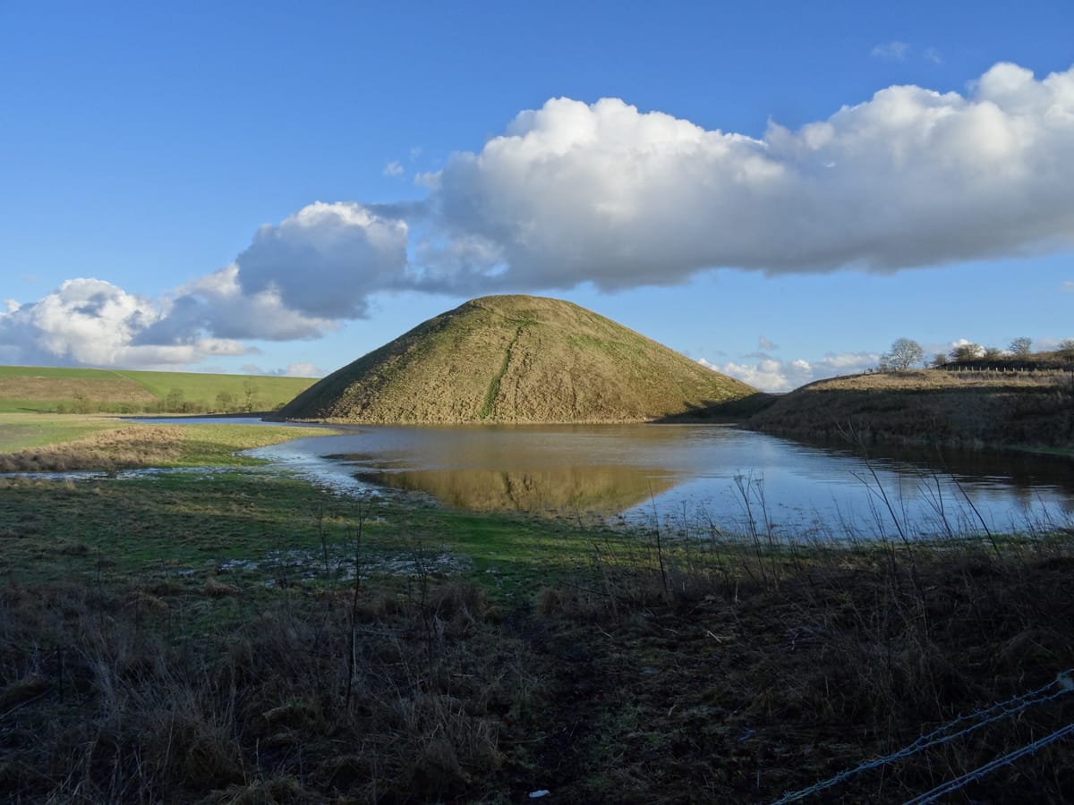 The mound's encircling ditch filled with water after heavy rainfall, which fed it via natural springs in prehistory.
