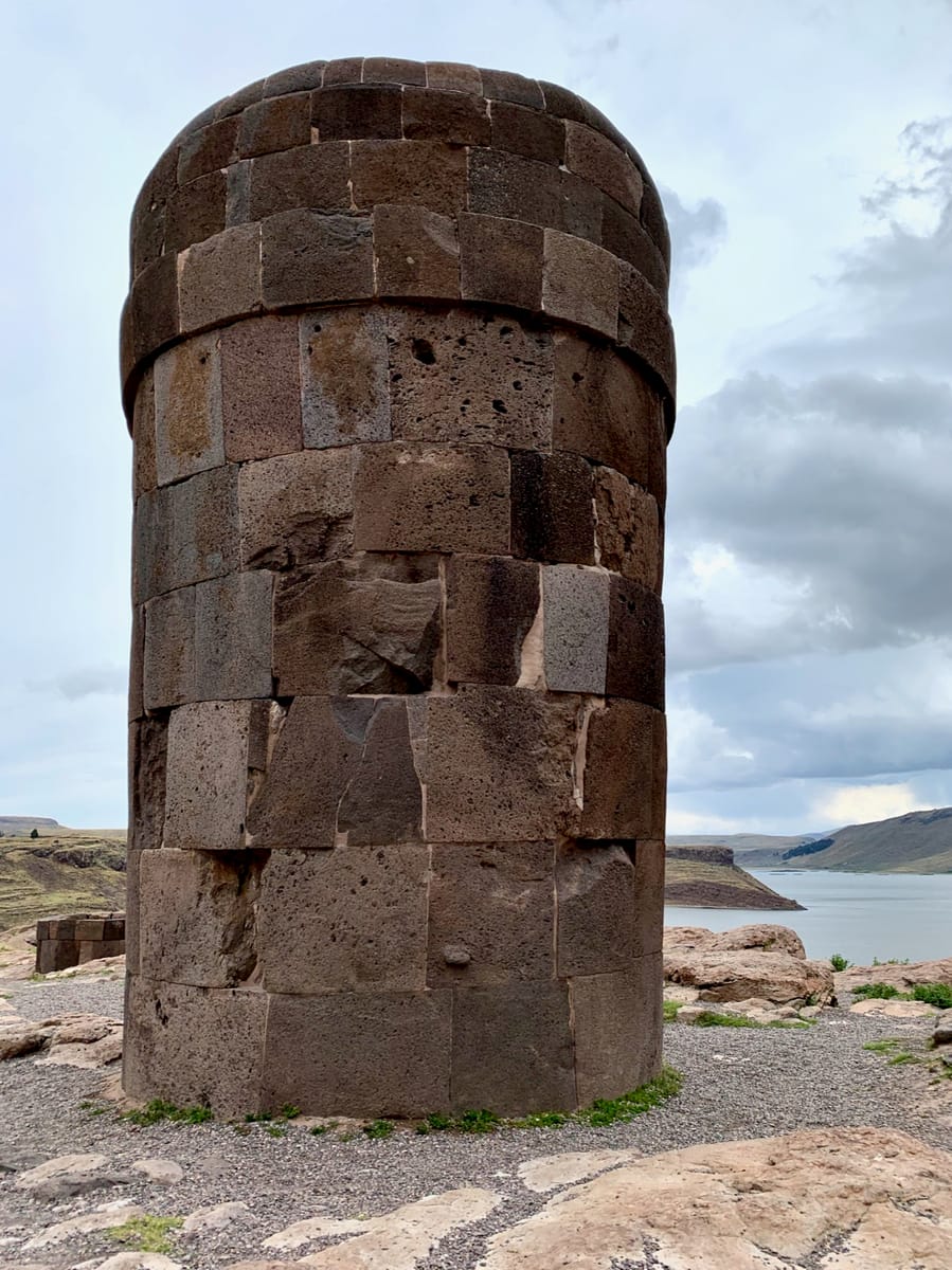Close fitted, mortarless masonry on a Sillustani chullpa, where curved blocks are dressed to sit tight against their neighbors.