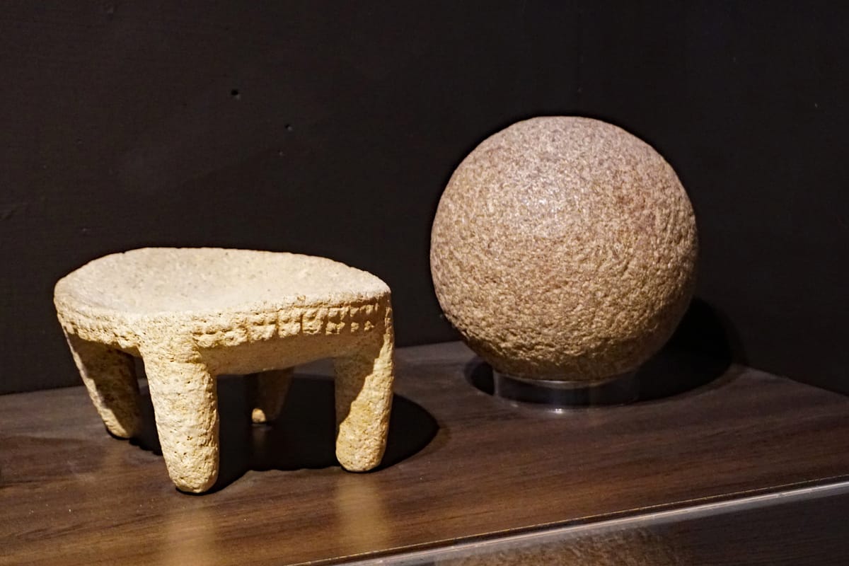 Diquís stone spheres of several sizes on display at the Museo de Jade in San José, showing the smooth, close-to-uniform curvature typical of the finished stones.