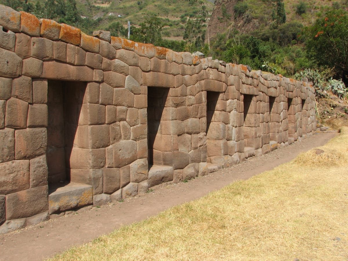 Close view of Tarawasi's famed polygonal andesite wall, its many-sided blocks ground and interlocked without mortar.