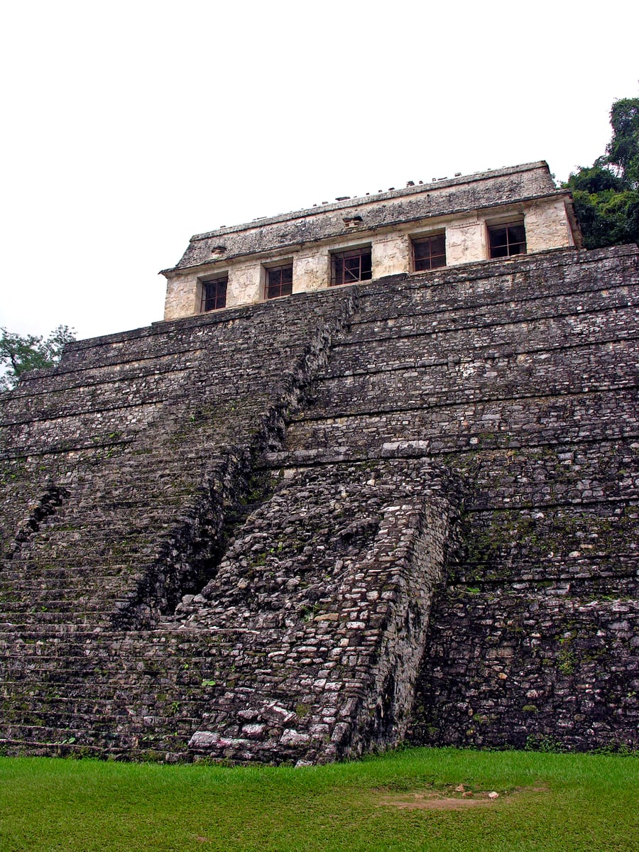 The temple at the summit. Behind the glazed openings are the three great tablets whose 617 glyphs give the building its name — one of the longest Maya texts known.