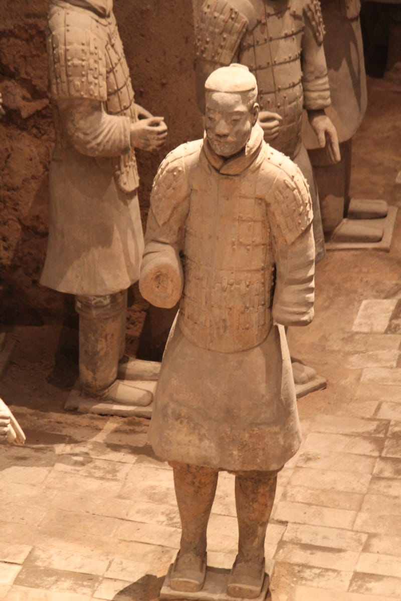 A single warrior seen close up — the moulded body was hand-finished so that facial features, hair and expression differ from figure to figure.