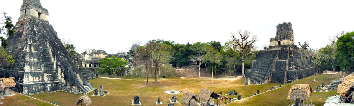 The Great Plaza, with Temple I at left and Temple II facing it across the open ground — a pair, built to look at each other.