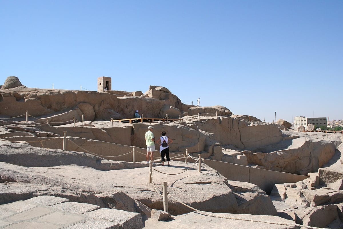 The wider northern quarry landscape around the obelisk, its pounded and split granite surfaces still bearing the marks of ancient stone extraction.