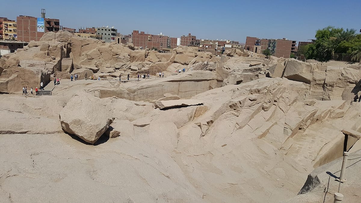 An overview of the quarry site, showing the broken, trenched bedrock left behind after millennia of granite extraction at Aswan.