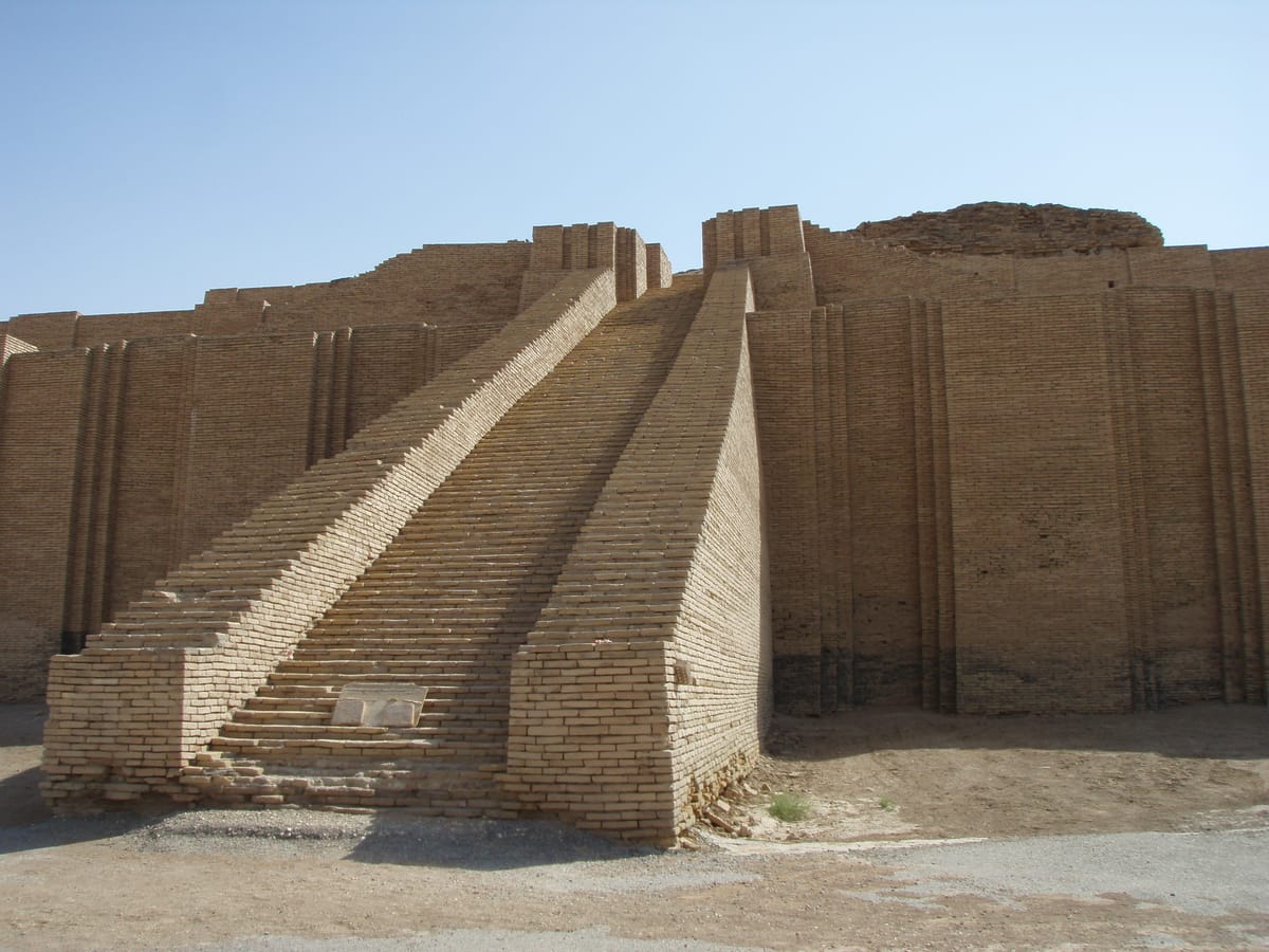 The three great staircases — one running straight out from the façade, two climbing along it — converging where a gatehouse once stood. Each flight is said to have had a hundred steps.